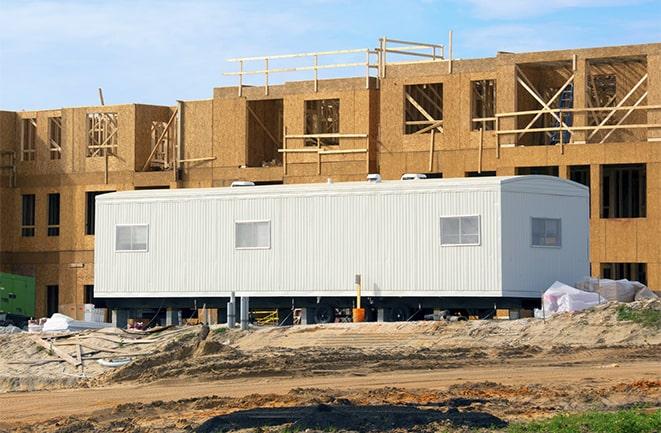 construction office rentals with signage for leasing information in Itasca